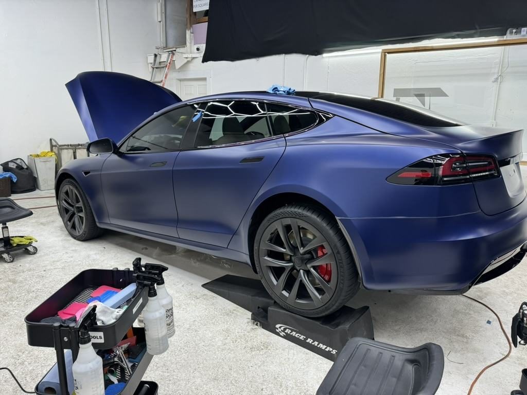 Matte blue Tesla Model S in the 68 Auto Film bay