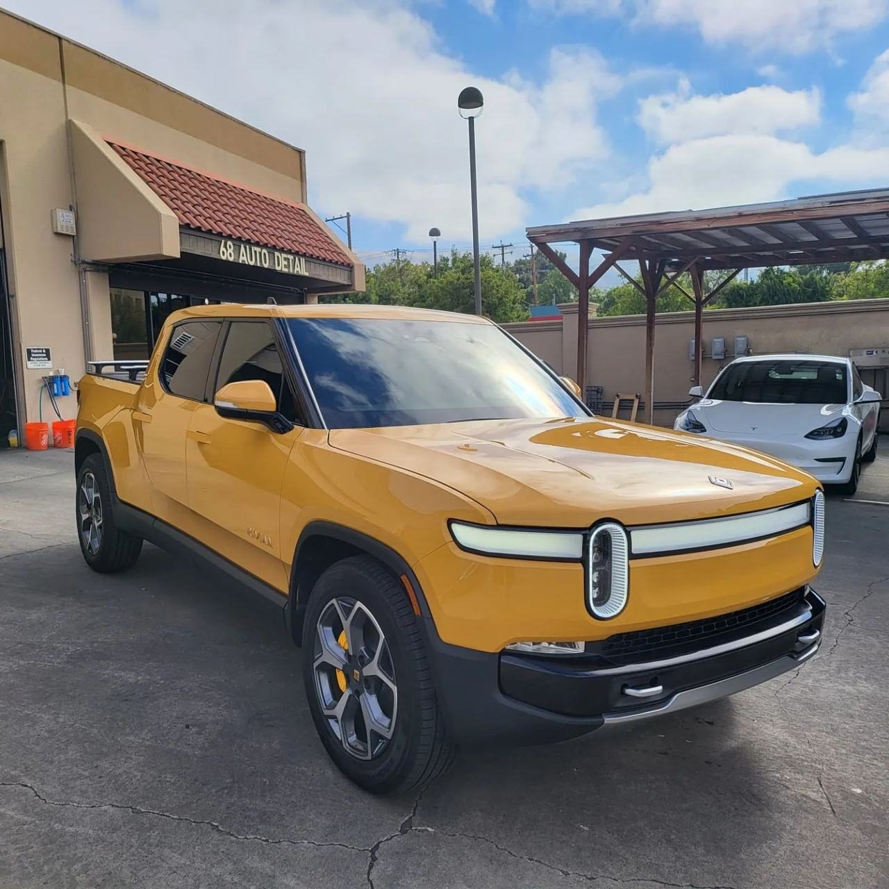 Yellow Rivian R1T outside 68 Auto Film in Milpitas