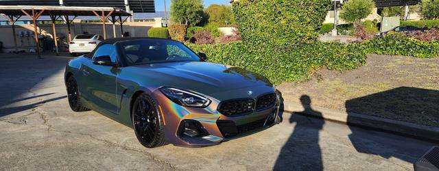 BMW Z4 in color-shift wrap with rainbow reflections