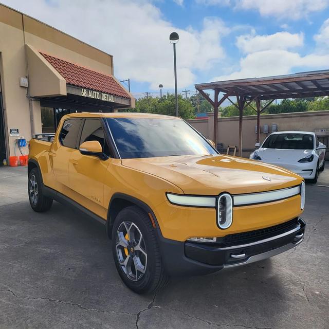 Yellow Rivian R1T outside 68 Auto Film in Milpitas